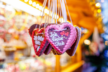 Gingerbread Hearts at German Christmas Market. Nuremberg, Munich, Fulda, Berlin, Hamburg xmas market in Germany. In German language I love you.