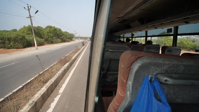 The view from the window of an intercity bus in India. State of Goa.