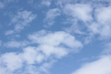 Beautiful clouds floating on the vast blue of the sky