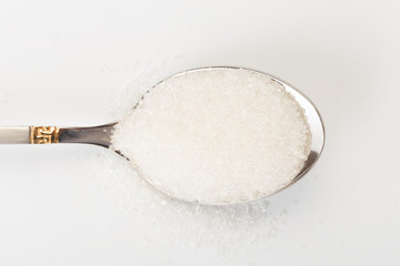 Spoon of fine granulated sugar isolated on white  - Image