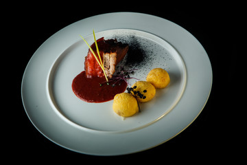 top view of tasty meat with potato balls and red sauce