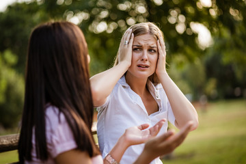 Businesswoman is being fired. Colleague is comforting her.