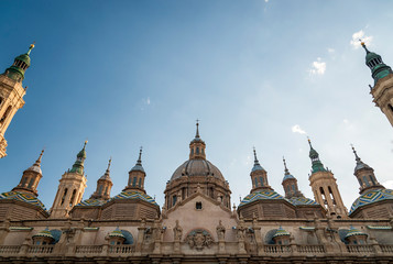 Fototapeta premium Panoramic view of the exterior of the Cathedral of El Pilar, in Zaragoza (Spain), at sunrise.
