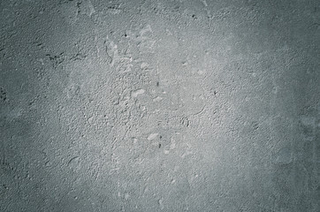 Urban concrete wall background with grooves and bubbles. Cement gray wall. Urban and industrialization art concept. Texture like concrete, stone, cement, plaster.. Poster mockup. Сloseup studio shot.