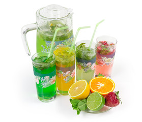 Cold mint drinks with fruit and berry on white background