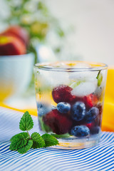 Glass with berries and ice