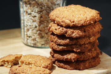 Homemade oatmeal cookie at dark background