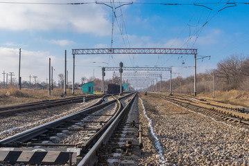 Fototapeta na wymiar Landscape with railway infrastructure in central Ukraine at fall season
