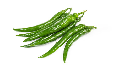 Fresh green chili peppers on a white background