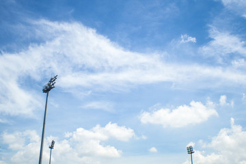 Three stadium light with blue sky in the football stadium.