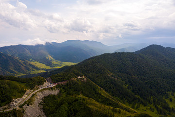 Naklejka premium Landscape mountain with beautiful forest with turquoise. Panoramic. Travel background. Highway at mountain. Quadrocopter Highlands