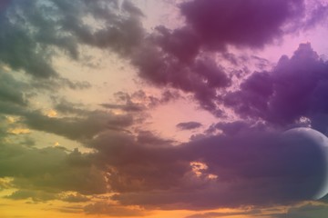 wonderful unreal vivid fantasy sun colored clouds on the sky for using in design as background.