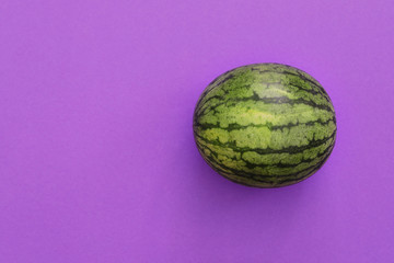 Watermelon isolated in violet background viewed from above