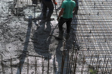 Concrete pouring during commercial concreting floors of buildings in construction