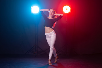 Young woman dancing in the dark, emotions and enjoyment