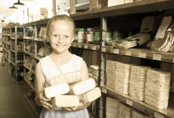girl posing with cookies in supermarket