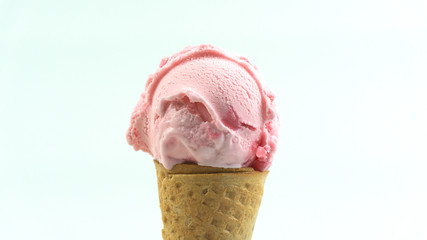 Strawberry ice cream scoop in waffle cone isolated on white background, Closeup Front view Food...