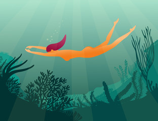 Girl diver on coral reef