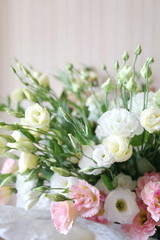 a bouquet of delicate white and pink eustomas