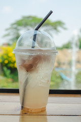 Fresh Lemon plum soda and ice cube with lime on top for summer time on white background.