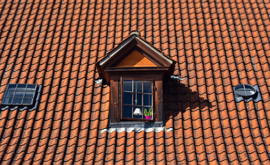 exterior window attic of old european house with roof tile