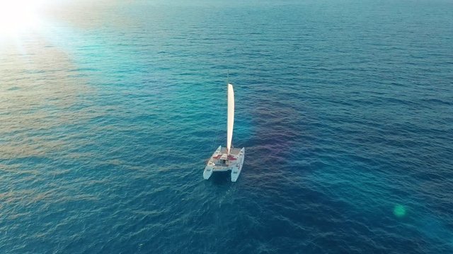 Catamaran sailing on the sea. Aerial shoot of the Catamaran sailing in the wind.