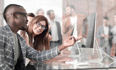 company employees discussing work issues at the Desk