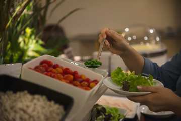 Woman eat the breakfast set in a hotel - people with breakfast in hotel concept