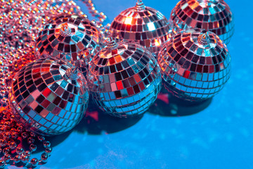 Mirror party balls put on table close up