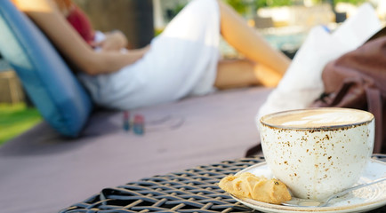 A cup of coffee in the fresh air at the pool.