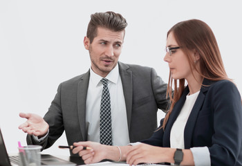 man and woman sitting at table in co-working office