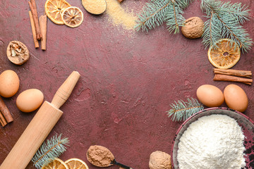 Frame made of ingredients for Christmas pie on color background