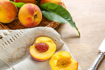 Tasty peaches on wooden table