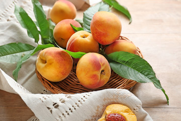 Tasty peaches on wooden table