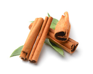 Aromatic cinnamon sticks on white background
