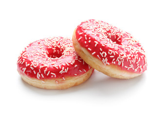 Sweet tasty donuts on white background