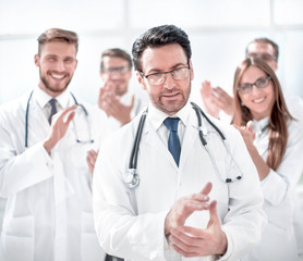 successful doctor, accepting congratulations from colleagues