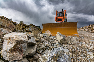 excavators removing stone in the construction works of a road