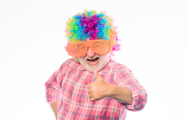Nice joke. Grandpa always fun. Man senior bearded cheerful person wear colorful wig and sunglasses....
