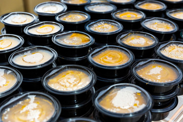 Warm soups in plastic dishes