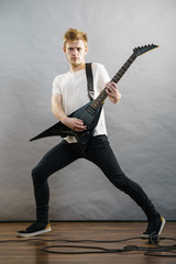 Fototapeta premium Man playing on electric guitar