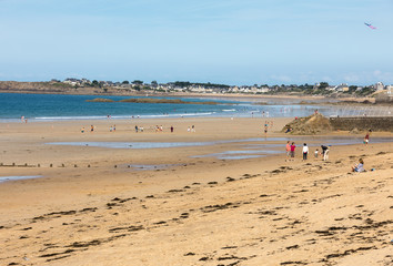  Romantic walk of people on the picturesque beach of Saint Malo. Brittany, France