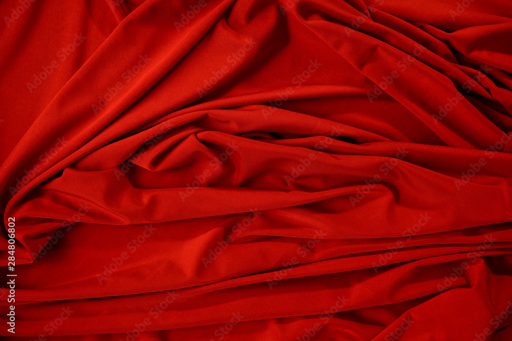 Wall mural background image of crumpled fabric. red cloth