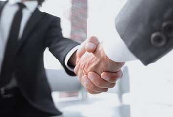 Close-up of two businessmens handshake
