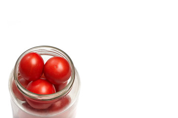 red tomatoes stacked in a secanar jar, preparation for canning..space for content or text