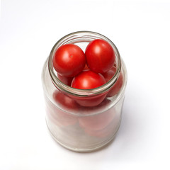 homemade canning of tomatoes, tomatoes in a glass jar on a white background
