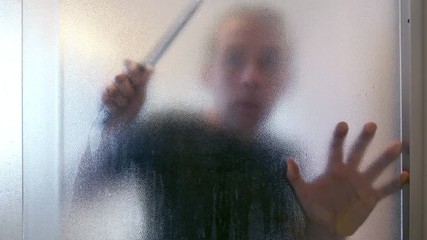 Killer with knife in the bathroom in 4K