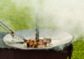 The meat is cooked in a cauldron