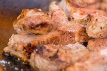The meat is cooked in a cauldron