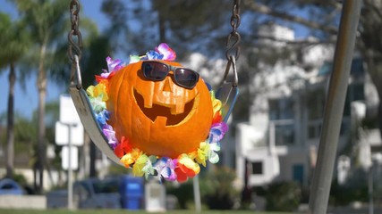 Happy Halloween pumpkin on the swing in 4K slow motion 60fps